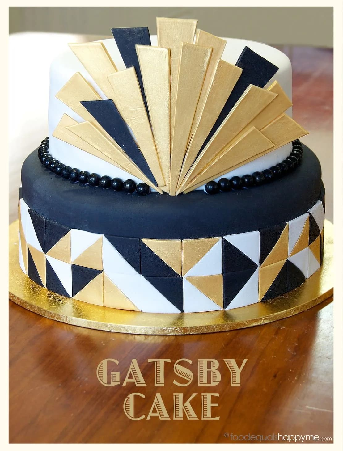 Two decorated cakes: a black-and-gold Gatsby design and a buttercream cake topped with fondant flowers.